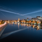 Bialystok city skyline with illuminated fiber optic cables symbolizing fast reliable internet